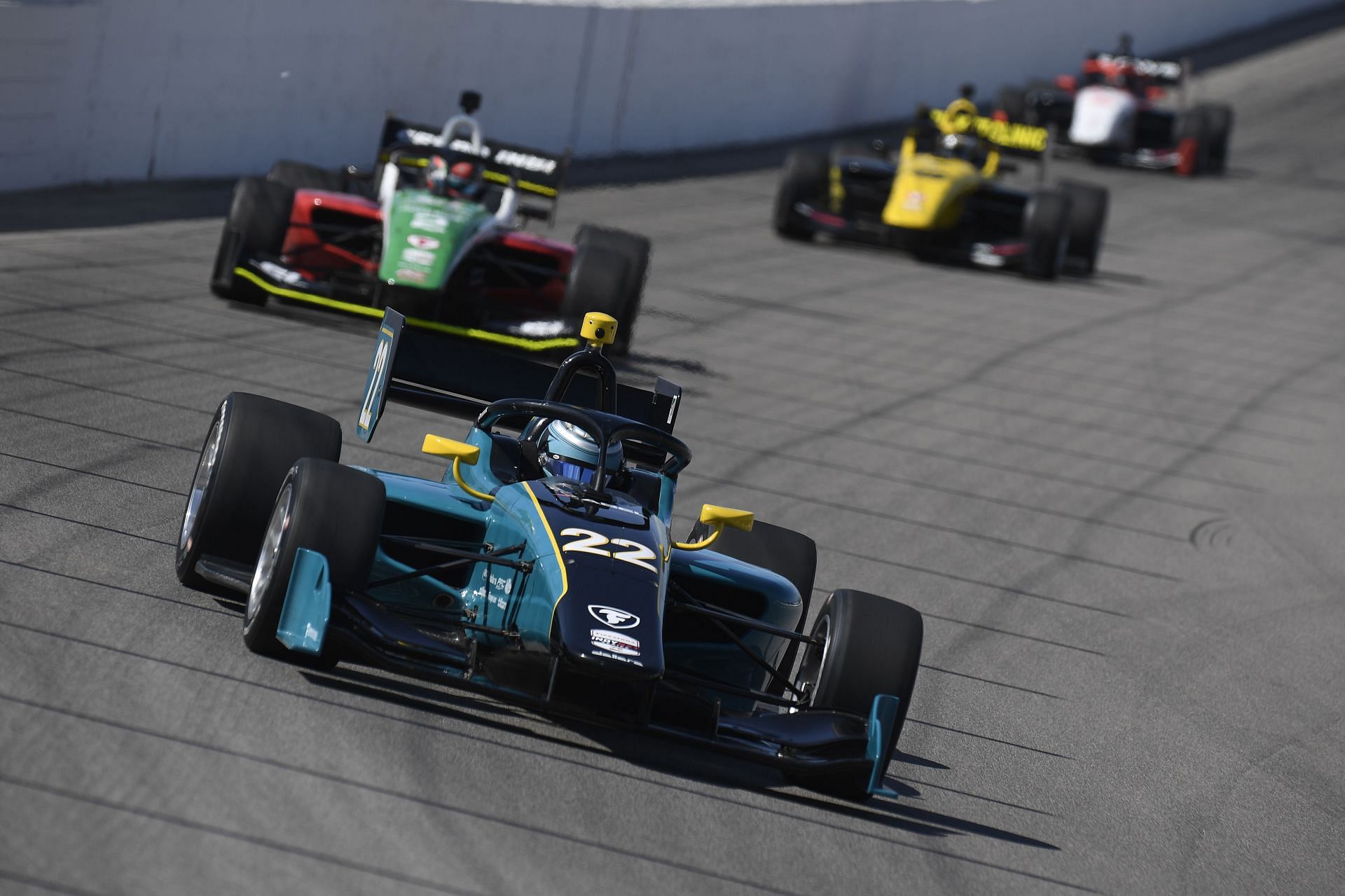 Yuven Sundaramoorthy leads a bunch of cars at the IndyNXT Series OUTFRONT Showdown - Source: Getty